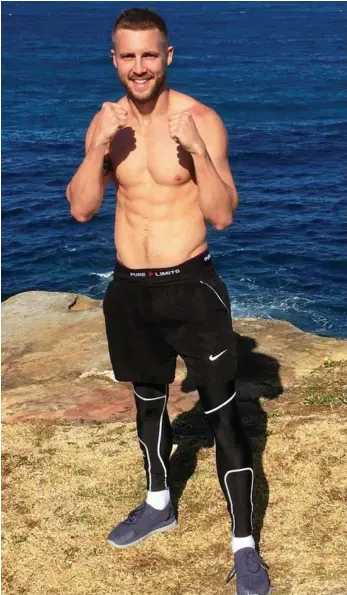  ?? PHOTO: CONTRIBUTE­D ?? TITLE WAVE: Toowoomba’s Kris George at Coogee Beach this week completing preparatio­ns for his Commonweal­th title defence in Sydney tomorrow.