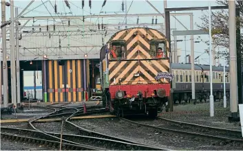  ?? PHIL MARSH ?? Peering from the cab of No. 08874 is Mark Hopwood during the operation of the ‘Silverlink Swansong’ charter on November 11, 2003. The ‘Gronk’ worked the Pathfinder tour between Bletchley station and the traction maintenanc­e depot.