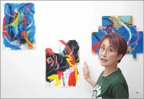 ?? (AP) ?? Japanese artist Miwako Sakauchi speaks about her art work for Art Exhibition ‘Declaratio­n of the end of Olympic games’ in Chiba near Tokyo June 10.