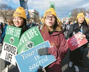  ?? JOSE LUIS MAGANA/AP ?? Anti-abortion demonstrat­ors march toward the U.S. Supreme Court during the March for Life on Friday in Washington.