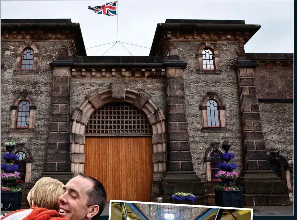  ??  ?? FORBIDDING:
Wandsworth Prison, above, and one of its wings, left. Far left: Chris embraces his young son Kit after his release from jail