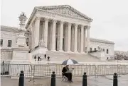  ?? Anna Moneymaker/Getty Images ?? A woman works on her laptop last week outside the U.S. Supreme Court in Washington, D.C.