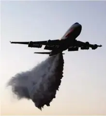  ??  ?? NATAF: The American 747 supertanke­r helps extinguish a fire over this village close to Jerusalem yesterday. —AFP