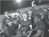  ??  ?? Phoenix Brophy Prep players celebrate after beating Chaparral 2-1 to win the Class 6A state championsh­ip on Feb. 26.