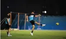 ?? Photograph: Alex Davidson/Getty Images ?? New Zealand’s Tim Southee has a shot as Kane Williamson watches on during a football match at the team’s net session for the T20 World Cup final.