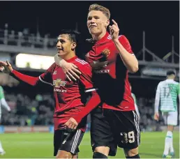  ??  ?? Alexis Sanchez, left, and Scott Mctominay celebrate Manchester United’s second goal. Picture: PA.