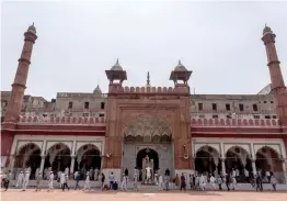  ?? — AFP ?? People leave after Friday prayers at Fathepuri Masjid after the government eased a nationwide lockdown imposed as a preventive measure against the Covid in New Delhi. The main mosque, which briefly reopened to worshipper­s, will again close over fears that the virus could spread, its management said.