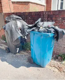  ?? ?? Overflowin­g bins in Grenfell Avenue. Photo by Maria Meerstadt.