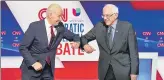  ?? REUTERS ?? ■
Joe Biden and Bernie Sanders do an elbow bump before the start of the Democratic candidates’ debate on Sunday.