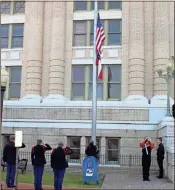  ?? Catherine Edgemon ?? A member of LaFayette High School’s band plays “Taps” as JROTC students salute the U.S. flag.