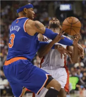  ?? RICK MADONIK/TORONTO STAR ?? The Raptors’ Alan Anderson, here being fouled by the Knicks’ Kenyon Martin, had a career-high 35 points Friday night in a losing effort to New York at the Air Canada Centre.