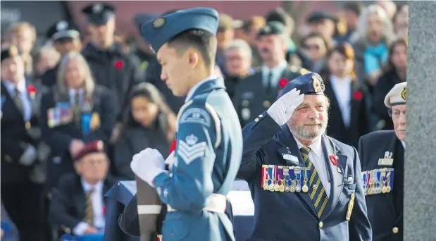  ?? — PHOTOS: ARLEN REDEKOP ?? Canadian Forces members, veterans and community members take part in Remembranc­e Day activities on Sunday.