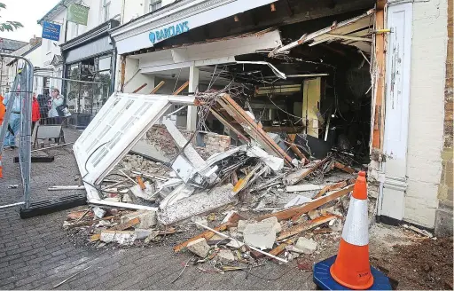  ??  ?? Smash for cash: The remains of Barclays in Olney, Milton Keynes, yesterday after thieves used a digger to break in