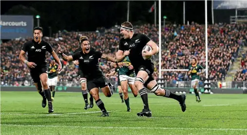  ?? PHOTO: GETTY IMAGES ?? Brodie Retallick is already celebratin­g as he prepares to score a brilliant counter-attacking try for the All Blacks. Team-mates Rieko Ioane, left, and Aaron Smith cheer him on.