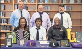  ?? Scott Herpst ?? Heritage senior C.J. Robertson signed his letter of intent to continue his baseball career with Lipscomb University this past Wednesday. On hand for the ceremony was Sonya and Chris Robertson, along with Heritage baseball coaches David Dinger, Eric Beagles (head coach) and Cody Lones.