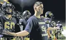  ?? LUIS SÁNCHEZ SATURNO/THE NEW MEXICAN ?? Water boy Jaiden Varner reacts as Escalante scores to raise its lead to 26-6 over Santa Fe High before halftime late Friday at Ivan Head Stadium. The Demons lost 39-6.