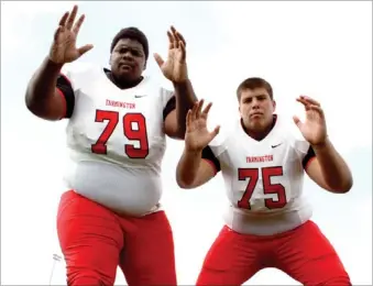  ?? MARK HUMPHREY ENTERPRISE-LEADER ?? Farmington senior linemen Thomas Clay (left) and Jeremy Alexander pose a formidable front.