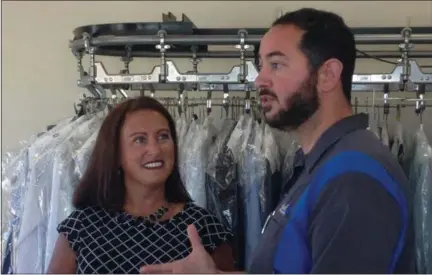  ?? JORDANA JOY — THE MORNING JOURNAL ?? Main Street Amherst Executive Director Teresa Gilles, left and vice president Michael Ciu during a Facebook live stream at Ridge Cleaners, 900 Amchester Way in Amherst.