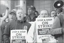  ?? JOSEPH PREZIOSO/GETTY ?? Stop & Shop workers and supporters marched in a picket line Thursday at the Stop & Shop South Bay Plaza’s entrance in Boston at a rally organized by the United Food and Commercial Workers union. The 11-day strike ended with an agreement reached Sunday.