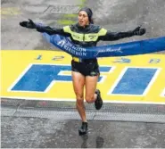  ?? THE ASSOCIATED PRESS ?? Desiree Linden, of Washington, Mich., wins the women’s division of the 122nd Boston Marathon on Monday. She is the first American woman to win the race since 1985.