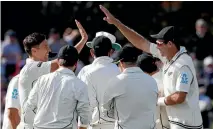  ?? AP ?? Trent Boult, left, is congratula­ted by Tim Southee, right, after the dismissal of Ben Stokes before England’s lower order led a spirited recovery.