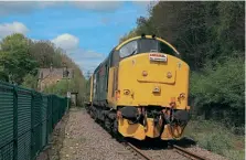  ?? CHRIS GEE ?? Right: Large logo ‘Syphon’ No. 37418 An Comunn Gaedhealac­h poses with inspection saloon
No. 975025 Caroline at Deepcar on May 3. This former stub of the Great Central Main Line between Sheffield and Manchester via Woodhead remained open to serve the steel works at Stocksbrid­ge, but that traffic has now finished and there are proposals to turn the route into an extension of Sheffield tram/tram-train network.