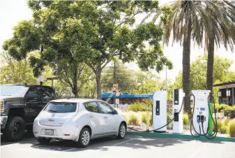  ?? Ramin Rahimian / Special to The Chronicle 2018 ?? More electricve­hicle charging stations would be placed in both public and private parking lots and garages in S.F. under legislatio­n city officials are expected to introduce Tuesday.