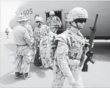  ?? SEAN KILPATRICK THE CANADIAN PRESS ?? Canadian troops arrive to a UN base in Gao, Mali, on Monday.