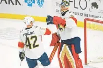  ?? AP ?? Panthers goaltender Anthony Stolarz (41) celebrates with defenseman Gustav Forsling after a win over the Sabres on Feb. 15 in Buffalo, N.Y.