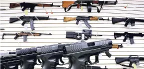  ?? FILE ?? In this January 2013 file photo, assault weapons and handguns are seen for sale at Capitol City Arms Supply in the US.