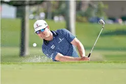  ?? AP Photo/Marta Lavandier ?? ■ Zach Johnson hits from a bunker on the third hole during the first round of the Honda Classic tournament Thursday in Palm Beach Gardens, Fla.