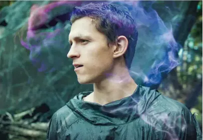  ??  ?? The colorful puff of smoke over his head means Todd (Tom Holland) is having a thought everyone can hear in “Chaos Walking.”