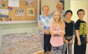  ?? JEREMY FRASER/CAPE BRETON POST ?? Jean and Alfred Landry are shown with Ferrisview Elementary School students, from left, Summer Scott, Jennifer Le and Liam Brown. Over the course of the school year, students and staff at the North Sydney school collected and donated tabs from aluminum...