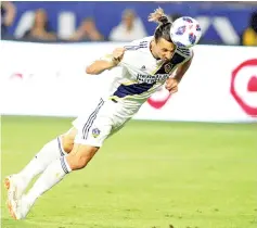  ??  ?? Swedish striker Zlatan Ibrahimovi­c of the Los Angeles Galaxy, shown scoring on a July header against Orlandio City, was named Major League Soccer Newcomer of the Year on Monday. - AFP photo