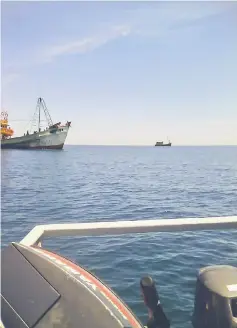  ??  ?? Two foreign fishing vessels seen fishing illegally eight miles from Kuala Sibuti.