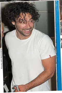  ??  ?? Smile: Aidan Turner greets the waiting crowd