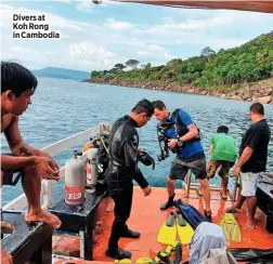  ??  ?? Divers at Koh Rong in Cambodia