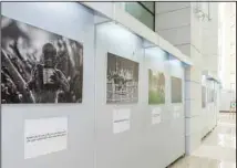  ?? KUNA photos ?? Left: Director General of the Kuwait National Library Sheikha Rasha Nayef Al-Jaber Al-Sabah. Right: Volunteer work photos on exhibit.