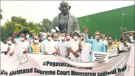  ??  ?? Opposition parties’ MPs stage a protest against Pegasus project during the monsoon session on July 23. The defence ministry on Monday denied any contract with the spyware maker, NSO group.