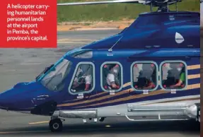  ??  ?? A helicopter carrying humanitari­an personnel lands at the airport in Pemba, the province’s capital.