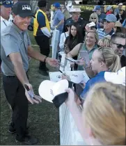  ?? K.M. CANNON — THE ASSOCIATED PRESS ?? Phil Mickelson signs autographs after finishing the 18th hole during the second round of Shriners Hospitals for Children Open at TPC Summerlin in Las Vegas on Oct. 4.