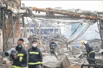  ??  ?? Firefighte­rs work on the site following an explosion at a pesticide plant owned by Tianjiayi Chemical. — Reuters photo