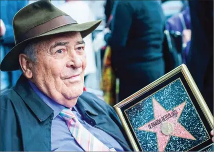  ?? AFP ?? Director Bernardo Bertolucci celebrates his Star on the Hollywood Walk of Fame in November 2013 in Hollywood, California.