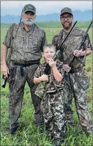  ?? (Photo submitted by Jeff Lawrence) ?? Jeff Lawrence (left) Pierce Lawrence, 6, and Tyler Lawrence represente­d three generation­s of hunting tradition afield Saturday on opening day of dove season in Pulaski County. The Lawrences are prominent in conservati­on circles.