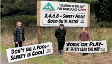  ??  ?? Forest safety campaign winner Cole Hodson, centre, as well as Sophie and Charlotte Cusack, display their competitio­n entries.