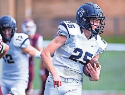  ?? KELLY MARSH/FOR THE TIMES HERALD-RECORD ?? Burke’s Liam Benzinger drives downfield during the Section 9 Class C championsh­ip football game in Newburgh on Nov. 12, 2022.