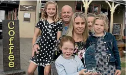  ?? BARRY HARCOURT ?? Sandfly Cafe owners Carolyn and Doug Fox with their children Libby, 9, Gabbie, 12, Harper, 4, and Cameron, 7, won the AWS Legal Fiordland Tourism Operator of the Year 2017 award at Destinatio­n Fiordland’s 41st Annual Fiordland Tourism Awards.