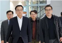  ?? Yonhap ?? Finance Minister Choi Sang-mok (left) arrives at Incheon Airport on Tuesday, to travel to Washington for a meeting of the Group of 20 finance ministers in this photo provided by the Finance Ministry.