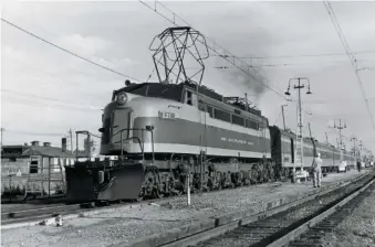  ?? Fred Matthews Jr. ?? Two Little Joe electrics were modified for passenger service. One was E21, seen at Deer Lodge, Mont., with train 15, the westbound Olympian Hiawatha, in 1951.