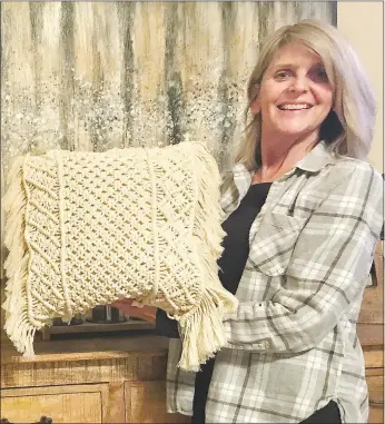  ?? Courtesy photo ?? Macramé artist Laura Fedel shows off the pillow cover she created. Fedel and her husband, who are Dallas, Texas, transplant­s, enjoy the quiet beauty of Bella Vista. The new friends she has discovered at Wishing Spring Gallery have made life here fun. Other artists have been very welcoming, she said.